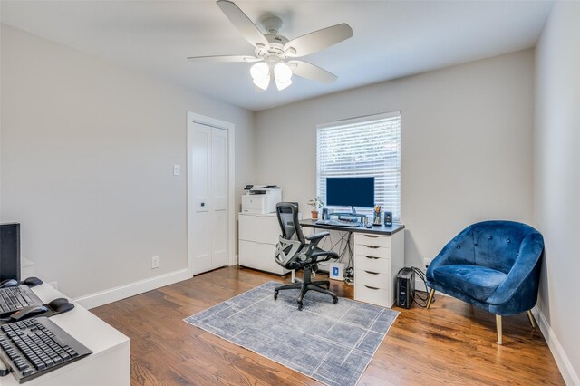 office with hardwood / wood-style flooring and ceiling fan