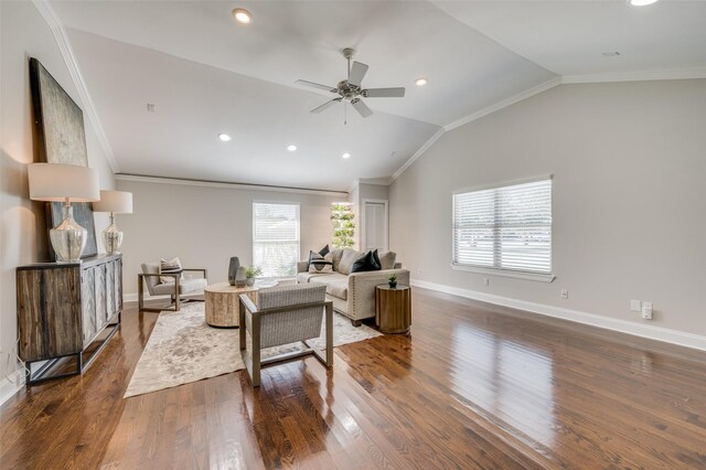 living room featuring wood-type flooring, vaulted ceiling, ceiling fan, and crown molding