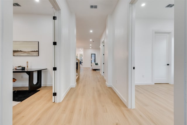 hallway featuring light hardwood / wood-style flooring