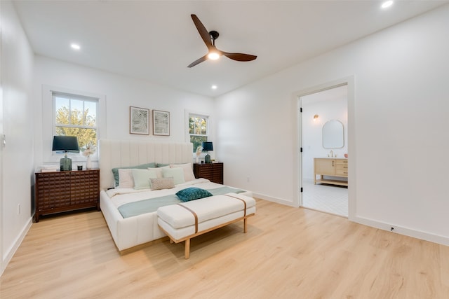 bedroom with light hardwood / wood-style floors and ceiling fan