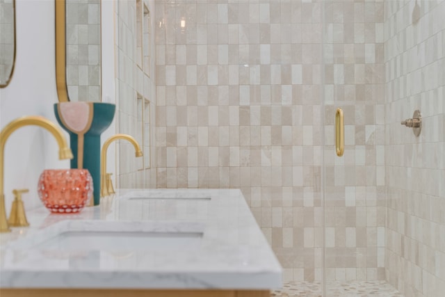 bathroom featuring walk in shower and sink