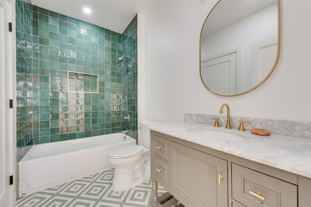 full bathroom featuring vanity, toilet, and tiled shower / bath combo