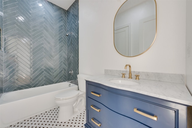 full bathroom featuring tile patterned flooring, vanity, toilet, and tiled shower / bath