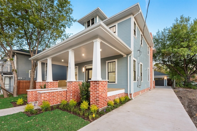 view of front facade with a garage and an outdoor structure