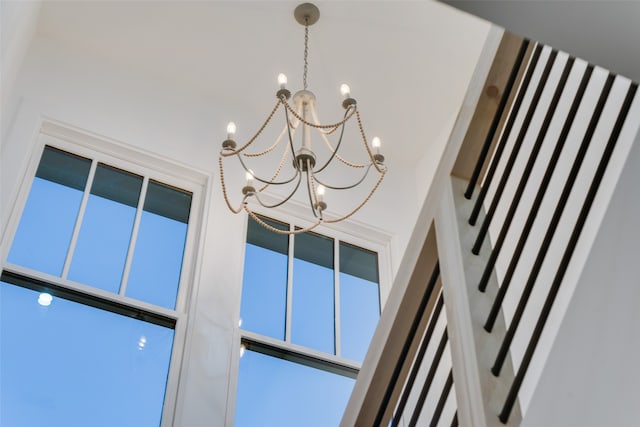 interior details featuring an inviting chandelier