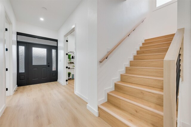 entryway with plenty of natural light and light wood-type flooring