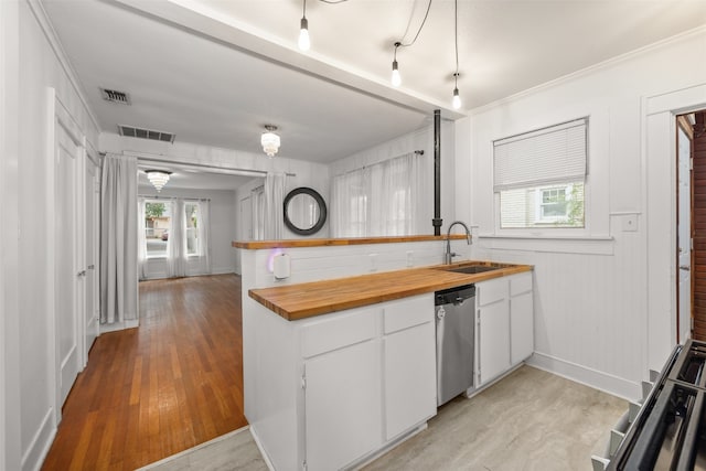 kitchen featuring sink, range, light hardwood / wood-style flooring, white cabinets, and dishwasher