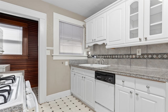 kitchen featuring white cabinets, tasteful backsplash, sink, and white appliances