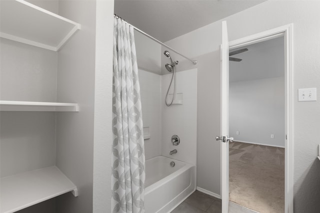 bathroom with tile patterned floors and shower / bathtub combination with curtain