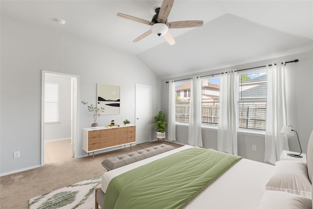 bedroom featuring light carpet, vaulted ceiling, and ceiling fan