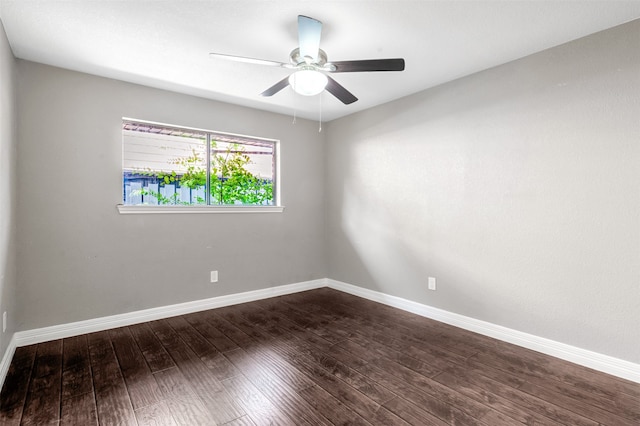 spare room with ceiling fan and dark hardwood / wood-style floors