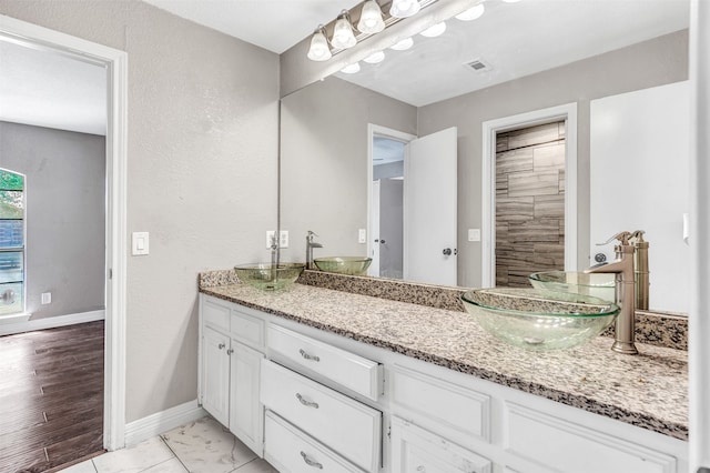 bathroom featuring hardwood / wood-style floors and vanity