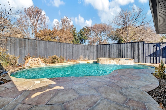 view of pool with an in ground hot tub