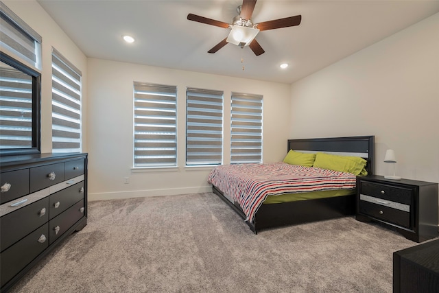 carpeted bedroom featuring ceiling fan