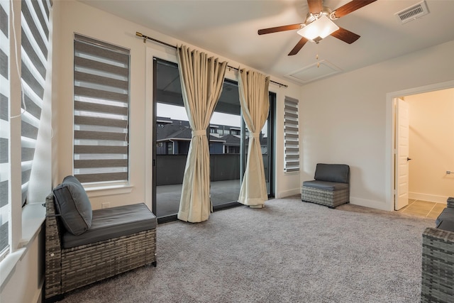 sitting room with carpet and ceiling fan