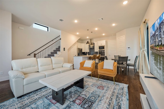 living room with dark hardwood / wood-style flooring