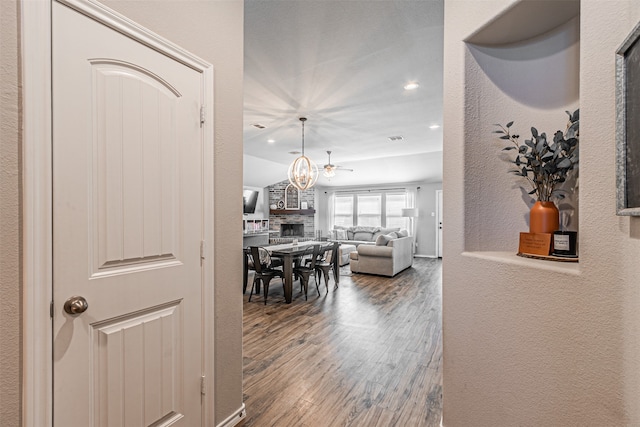 hall with hardwood / wood-style flooring