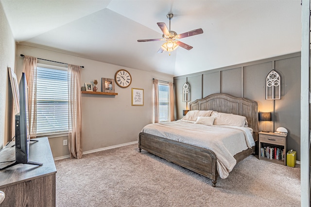 bedroom featuring vaulted ceiling, light colored carpet, and ceiling fan