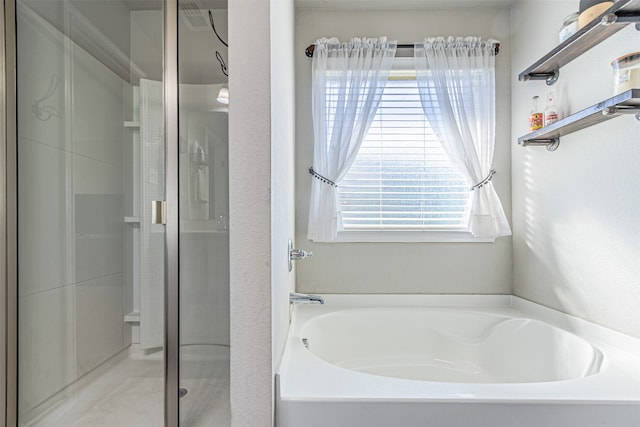 bathroom with separate shower and tub