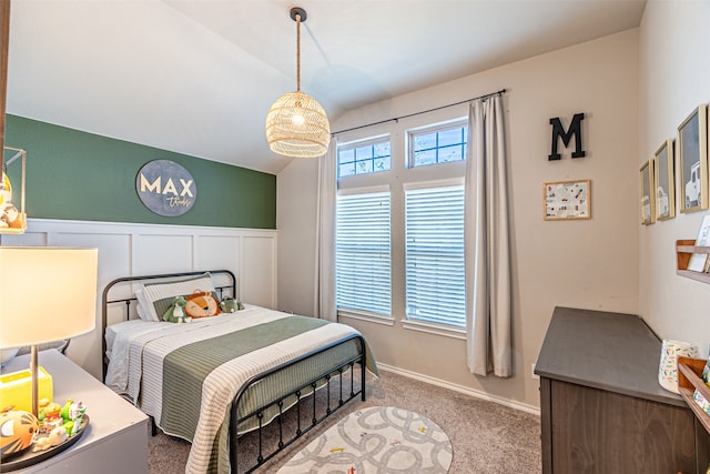 bedroom featuring lofted ceiling and carpet