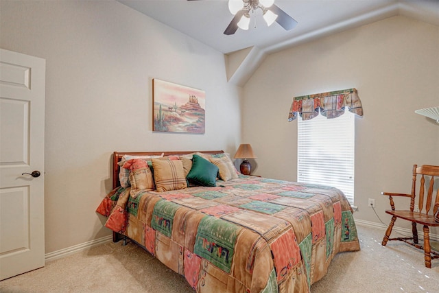 carpeted bedroom featuring vaulted ceiling, baseboards, and ceiling fan