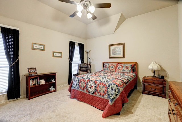 bedroom featuring light carpet, multiple windows, vaulted ceiling, and ceiling fan