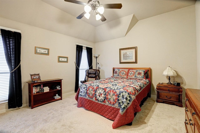 bedroom featuring lofted ceiling, carpet, baseboards, and ceiling fan