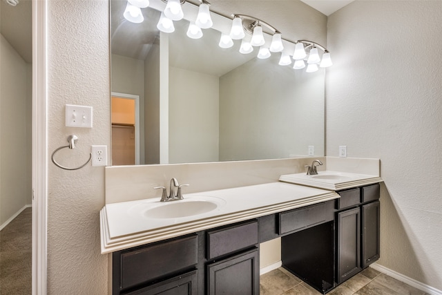 bathroom featuring tile patterned flooring and vanity