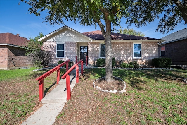 ranch-style home with a front yard