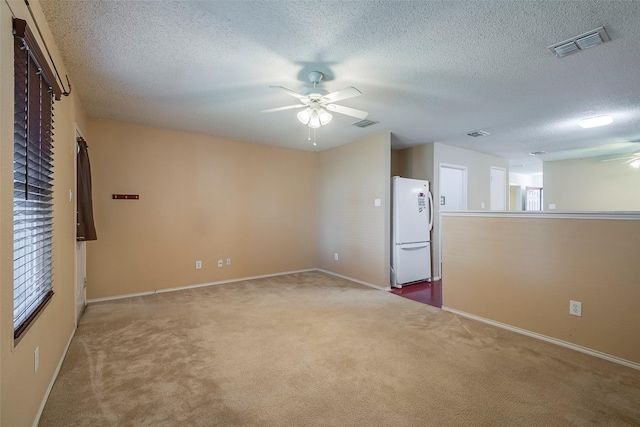 721 Grambling Dr, Dallas, TX 75241 - empty room featuring ceiling fan, carpet floors, baseboards, and a textured ceiling