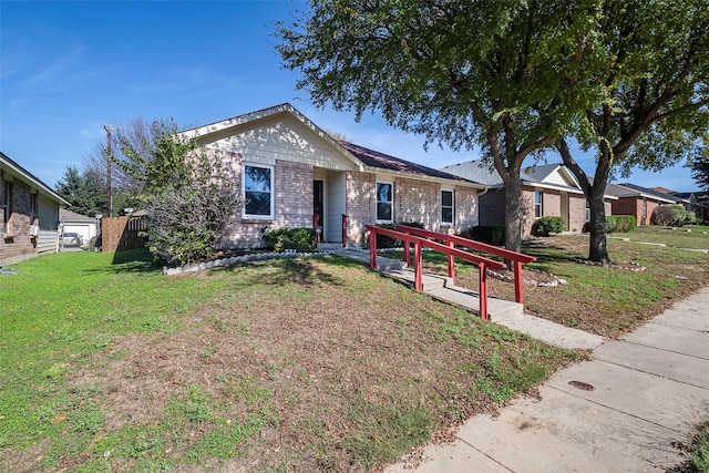 single story home with a front yard