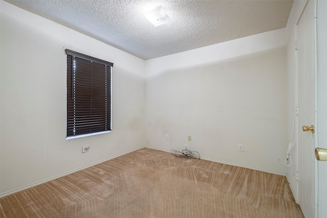 721 Grambling Dr, Dallas, TX 75241 - carpeted spare room featuring a textured ceiling