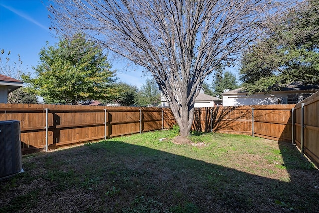 view of yard with central AC unit