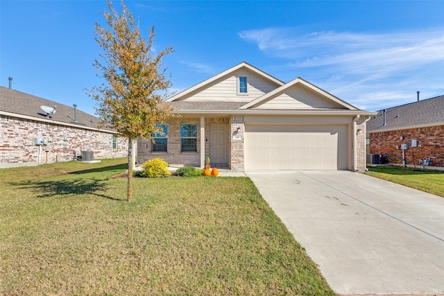 view of front of house featuring a front yard, a garage, and cooling unit