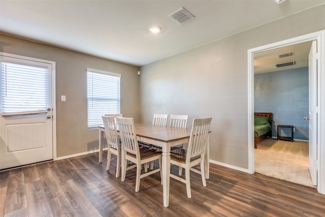 dining area featuring dark hardwood / wood-style floors and a wealth of natural light