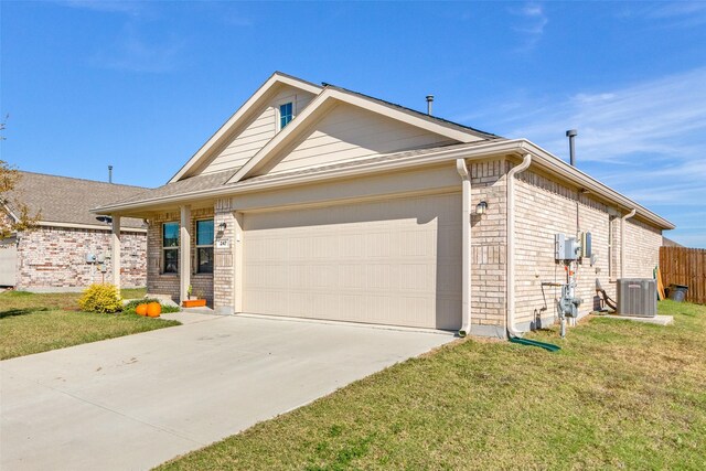 view of front of house featuring a garage, a front lawn, and central air condition unit