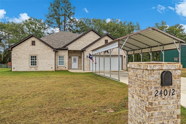 view of front of house featuring a front yard, a carport, and a garage