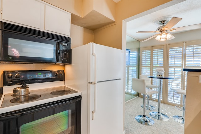 kitchen with ornamental molding, white cabinetry, carpet flooring, white appliances, and ceiling fan