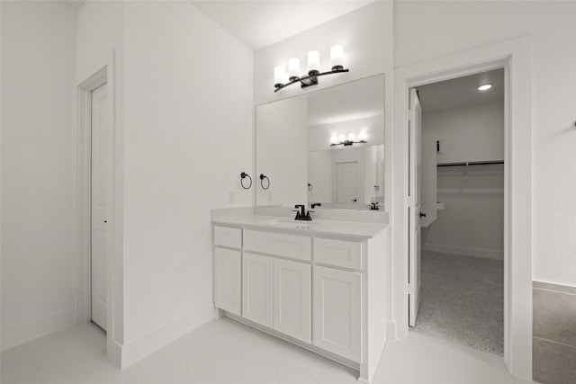 bathroom with tile patterned floors and vanity