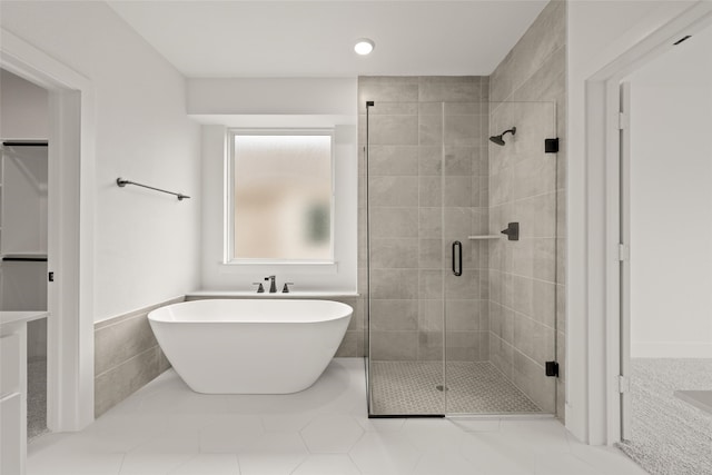 bathroom featuring tile patterned flooring and plus walk in shower