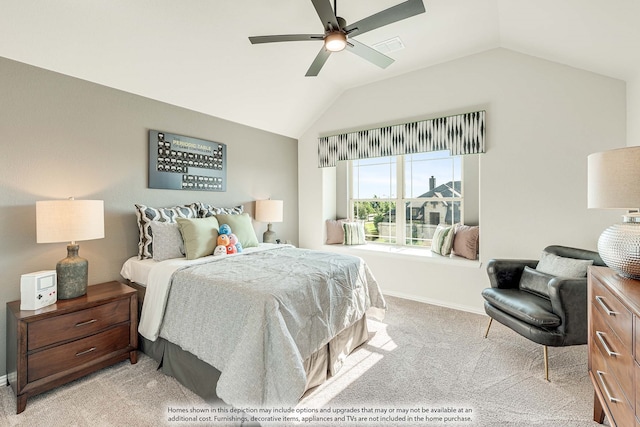 bedroom with light colored carpet, ceiling fan, and vaulted ceiling