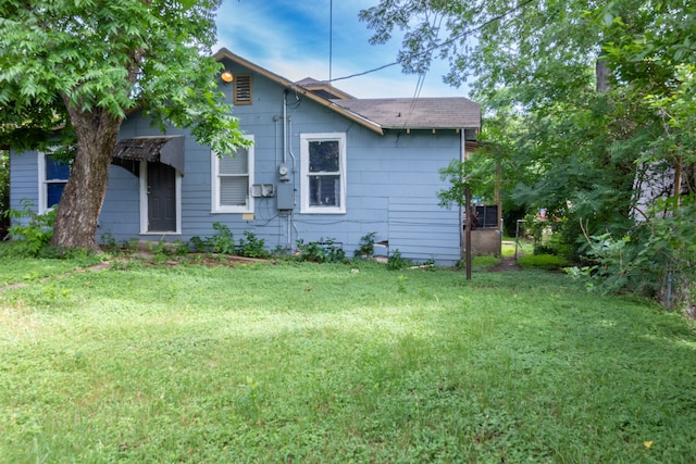 view of property exterior featuring a lawn