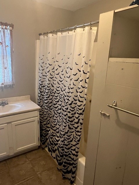 bathroom with shower / tub combo with curtain and vanity