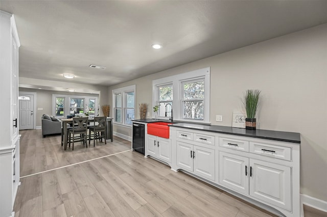 kitchen with white cabinets and plenty of natural light