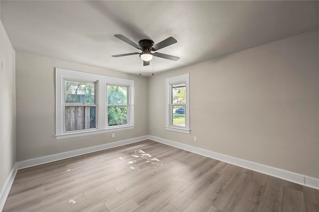 unfurnished room with ceiling fan and light hardwood / wood-style floors