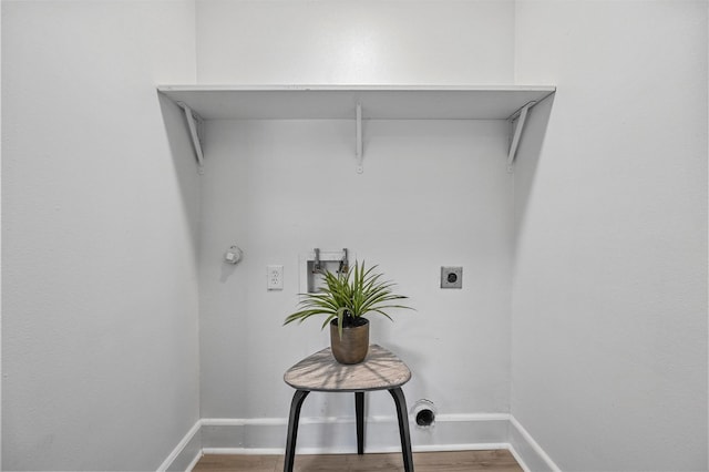 clothes washing area featuring washer hookup, hookup for a gas dryer, and electric dryer hookup