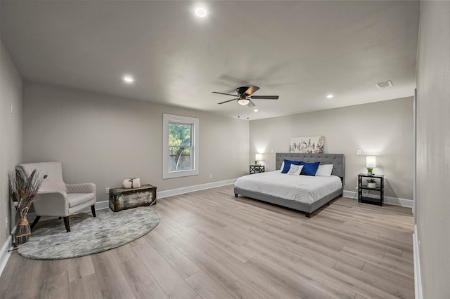 bedroom with light wood-type flooring and ceiling fan