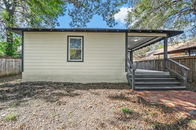 view of side of home with a deck