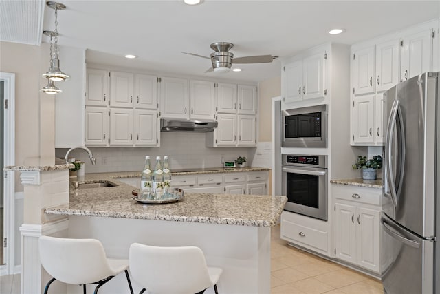 kitchen featuring white cabinets, appliances with stainless steel finishes, ceiling fan, and sink