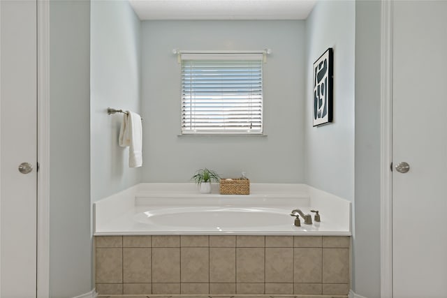 bathroom with tiled tub